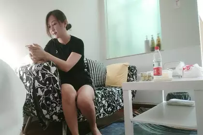 A female technician in black shorts gives a back massage service and deep throats her in front of the camera. She wears crotchless black stockings and fucks hard.