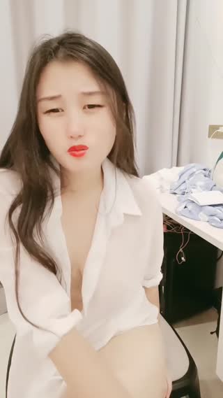 The charming young woman in a white shirt showed her face passionately throughout the whole process. She was very tempting in her black silk high heels and white shirt.