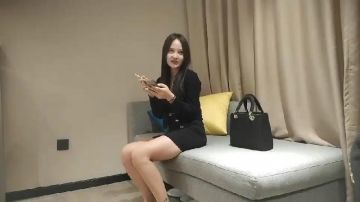 The high-end escort girl with flower arm tattoos and long legs in a hip skirt, lights a cigarette and flirts with him, takes a shower together and puts her head on him, kneels on the sofa with her hips raised, and holds her waist to penetrate him from behind...