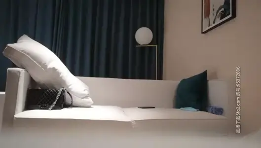 About a young woman in white with Denim shorts, flirting on the sofa, oral sex, licking milk and riding on the upper seat of the fierce exercise, moaning and panting is very attractive.